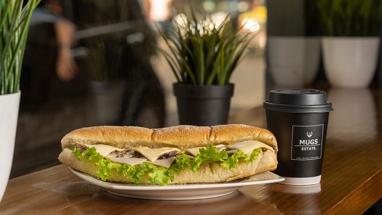 Mugs Estate - Sandwich with Coffee
